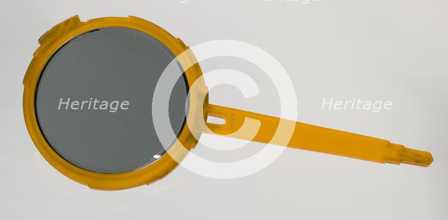 Bakelite hand mirror from dresser set owned by Lena Horne, mid 20th Century. Creator: Agalin.