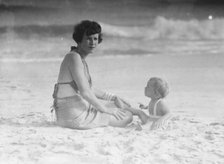 Mrs. George Eustis and child, at the beach, between 1911 and 1942. Creator: Arnold Genthe.