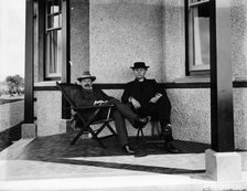 Lloyd George resting on the verandah of a house. Artist: Unknown
