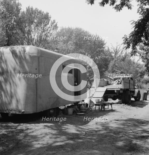 Possibly: The house trailer and the youngest little girl, Washington, Yakima Valley, Toppenish, 1939 Creator: Dorothea Lange.