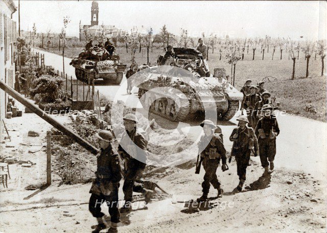 British 8th Army troops and tanks on the road to Ferrara, Italy, April 1945. Artist: Unknown