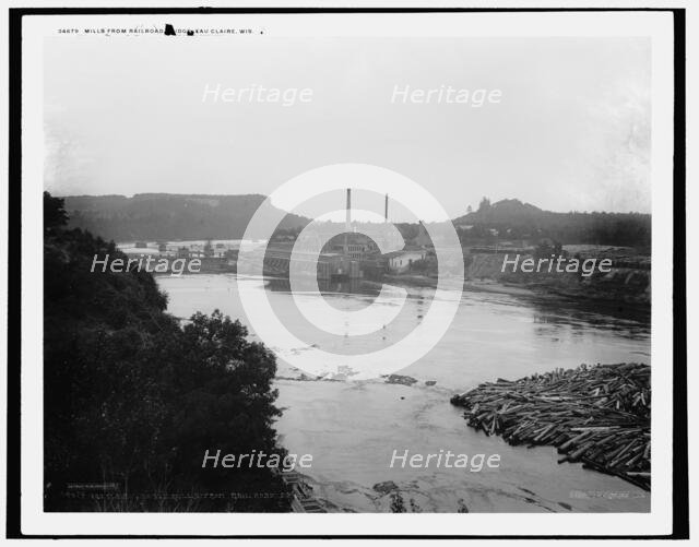 Mills from railroad bridge, Eau Claire, Wis., between 1880 and 1899. Creator: Unknown.