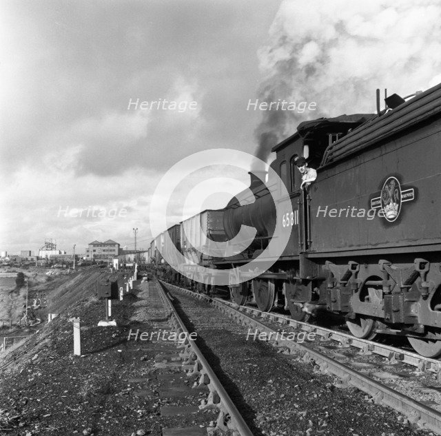 Steam loco no 65811 hauling coal from Lynemouth Colliery, Northumberland, 1963.  Artist: Michael Walters