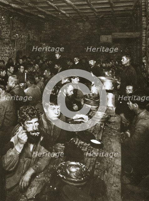 Russian manual labourers eating a meal, late 19th century. Artist: Unknown