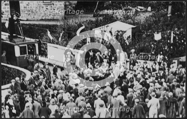 Crowd of people on Flora Day for the Helston Furry Dance, Helston, Cornwall, 1925-1935. Creator: George R Long.
