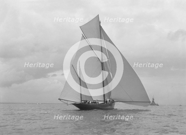 The yawl 'Harbinger' running downwind, 1922. Creator: Kirk & Sons of Cowes.