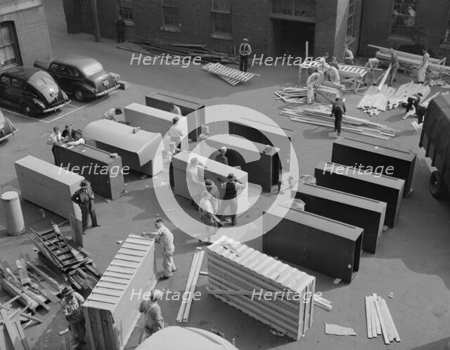 Possibly: United States government workers and carpenters making crates..., Washington, D.C., 1942. Creator: Gordon Parks.
