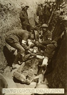 Wounded soldier being treated in the trenches, Battle of the Somme, First World War, 1916, (1935). Creator: Unknown.