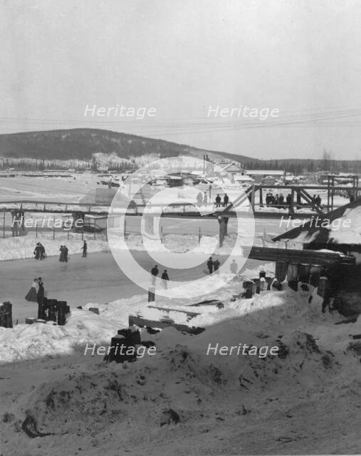 Winter bridge over river, between c1900 and c1930. Creator: Unknown.