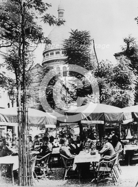 German soldiers relaxing outside a restaurant in Montmartre, Paris, June 1941. Artist: Unknown