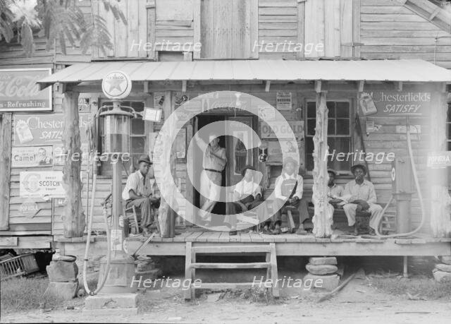 Country store on dirt road, Sunday afternoon, Gordonton, North Carolina, 1939. Creator: Dorothea Lange.