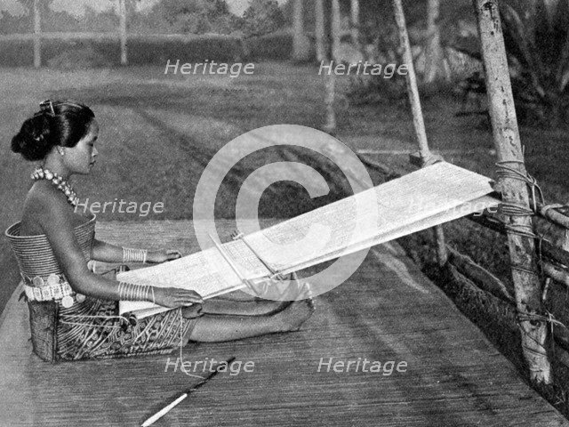 Iban weaver, Borneo, 1922. Artist: Dr Charles Hose