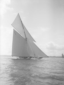 The 15-metre cutter 'Ostara' sailing close-hauled, 1911. Creator: Kirk & Sons of Cowes.