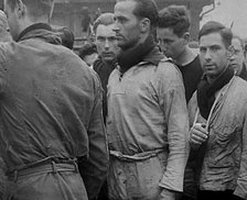 Crew of the Destroyed Bismarck Entering Captivity, 1943. Creator: British Pathe Ltd.