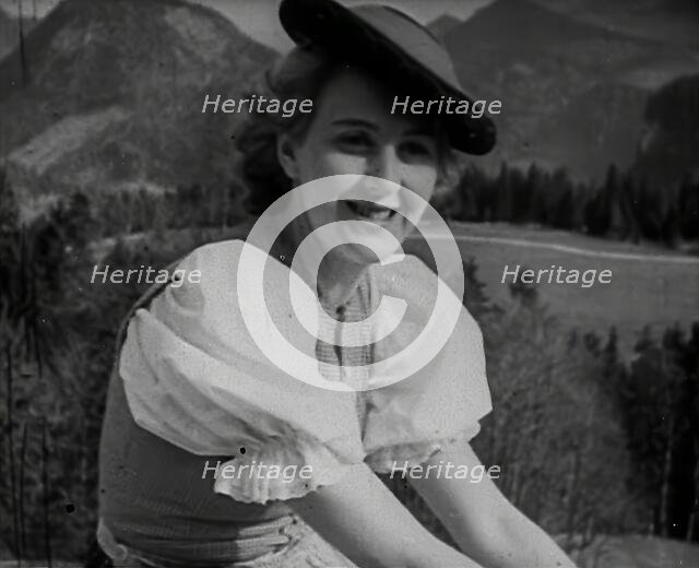 Eva Braun Sitting on a Wall, 1942. Creator: British Pathe Ltd.