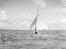 The 6 Metre 'Cynthia' running downwind under spinnaker, 1912. Creator: Kirk & Sons of Cowes.