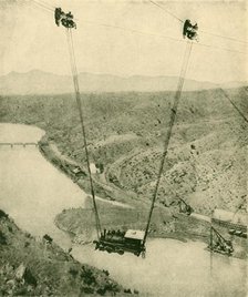 'A Contractor's Engine Being Swung Across A Canyon, Rio Grande River, New Mexico', 1930. Creator: Unknown.