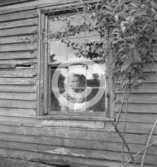 Wife and five month old baby of young tobacco sharecropper..., Granville County, N Carolina, 1939. Creator: Dorothea Lange.