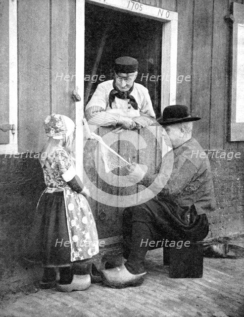 Dutch people wearing clogs, Marken, Holland, 1936.Artist: Donald McLeish