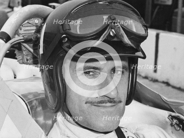 Graham Hill in cockpit of Lola T90, Indianapolis, 1966. Artist: Unknown