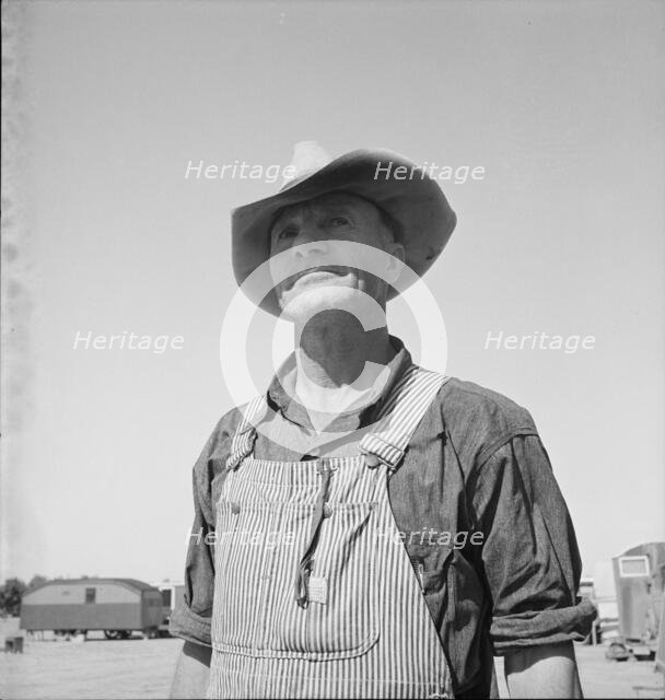 Nebraska farmer come to pick peas, near Calipatria, California, 1939. Creator: Dorothea Lange.