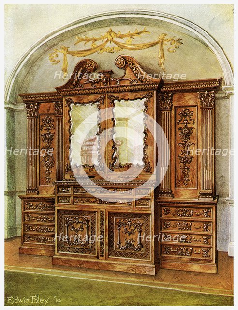 Carved enclosed mahogany bookcase, style of Chippendale, French influence, 1911-1912.Artist: Edwin Foley