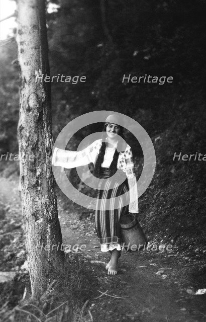 Young woman on a forest path, Bistrita Valley, Moldavia, north-east Romania, c1920-c1945. Artist: Adolph Chevalier