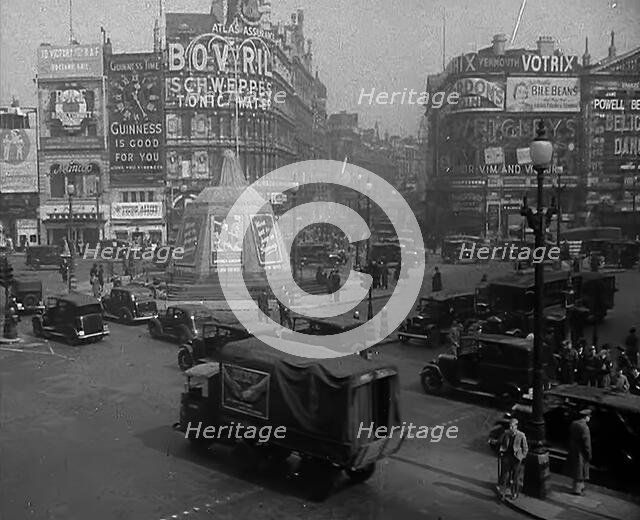 People and Traffic Moving Through a Busy Junction in London, 1943. Creator: British Pathe Ltd.