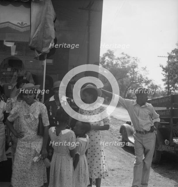 Possibly: Chatham County farmers in town on Saturday afternoon, Pittsboro, North Carolina, 1939. Creator: Dorothea Lange.