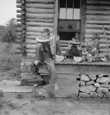 Millworker's children eating watermelon on porch..., Person County, North Carolina, 1939. Creator: Dorothea Lange.