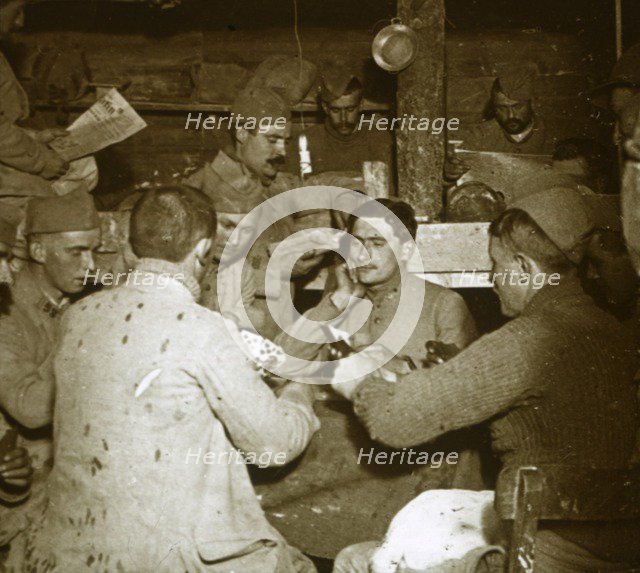 Soldiers playing Manille [card game] in the trenches, c1914-c1918. Artist: Unknown.