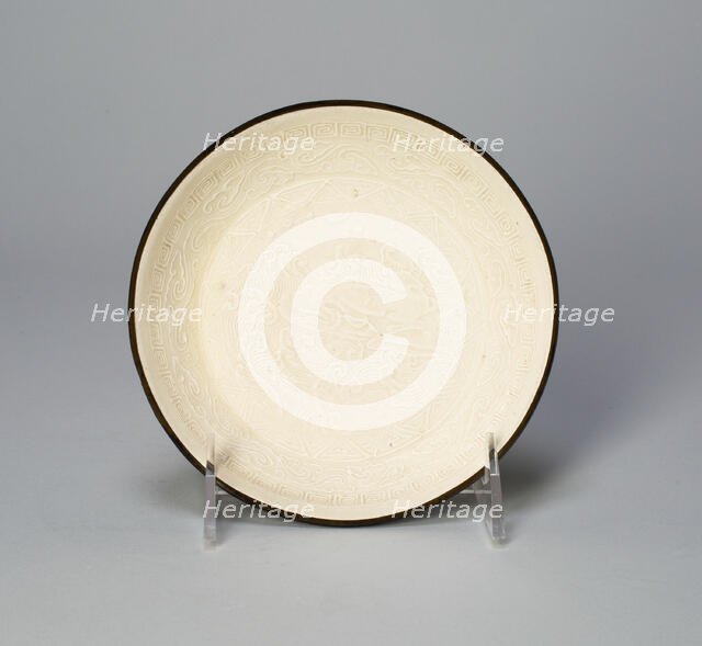 Dish with Mythical Bovine (Xiniu) Amid Waves Viewing the Moon and..., Jin dynasty, 12th cent. Creator: Unknown.