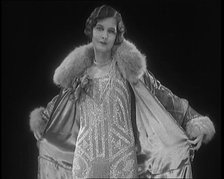 Female Civilian Modelling a Glamorous Fur Trimmed Coat, 1920. Creator: British Pathe Ltd.