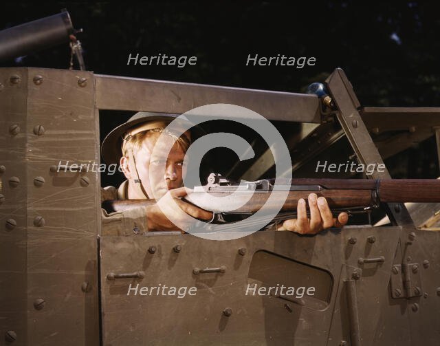 Halftrack infantryman with Garand rifle, Ft. Knox, Ky., 1942. Creator: Alfred T Palmer.