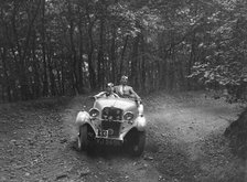 Singer competing in the B&HMC Brighton-Beer Trial, Fingle Bridge Hill, Devon, 1934. Artist: Bill Brunell.