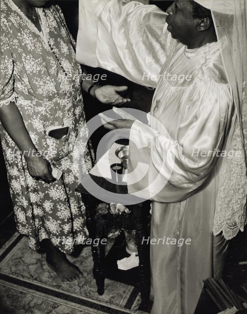 Contributions are made by all who receive the blessing and annointment..., Washington, D.C., 1942. Creator: Gordon Parks.