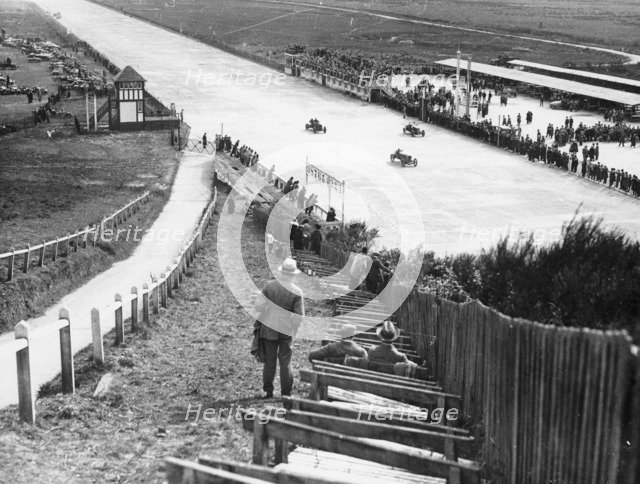 Spectators watching motor racing from the Test Hill, Brooklands, Surrey, (1920s?). Artist: Unknown