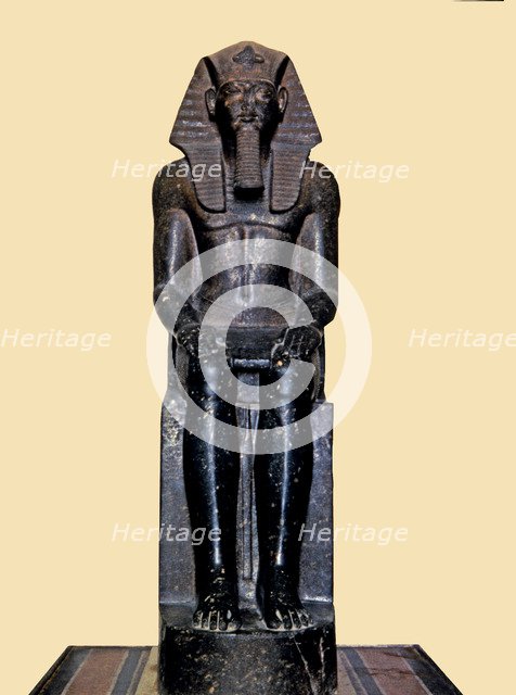 Front view of the seated statue of Ramses II, made in diorite, it comes from Tanis.