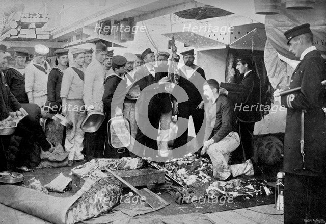 Serving out a day's fresh meat ration on board HMS 'Talbot', 1896. Artist: WM Crockett