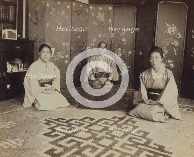 Japanese servants O Hero San, O Eun San, and O Sok San with tea utensils in the..., 1899. Creator: Eleanor Lord Pray.