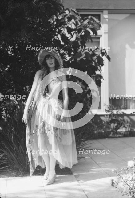 Barnett, Sally, Miss, standing outdoors, 1927 Creator: Arnold Genthe.