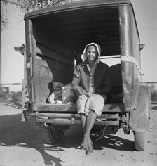 Migrant cotton picker on way to field, Kern migrant camp, California, 1936. Creator: Dorothea Lange.