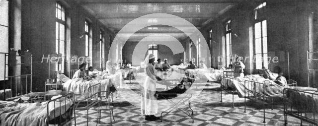 ' "La Guerre a L'Allemande"; Le lendamain de l'explosion,dans salle voisine et exactement..., 1918. Creator: Unknown.