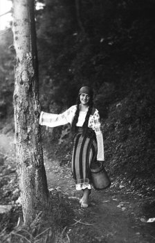 Young woman on a forest path, Bistrita Valley, Moldavia, north-east Romania, c1920-c1945. Artist: Adolph Chevalier
