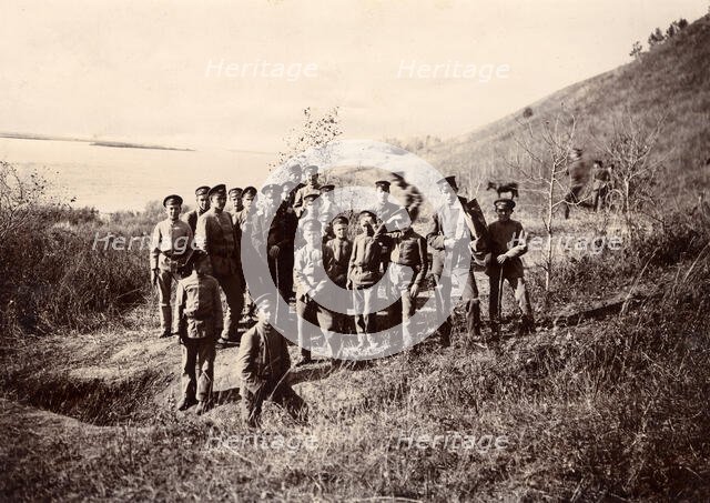 A group of Irkutsk high school students with a teacher on the bank of the river (Ushakovka), 1900. Creators: I. A. Podgorbunskii, V. I. Podgorbunskii.