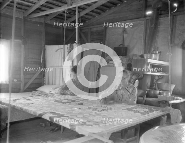 Grandmother from Oklahoma with grandson, working on quilt, California, Kern County, 1936. Creator: Dorothea Lange.
