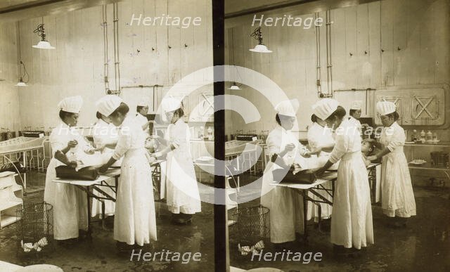 Japanese nurses attending to a patient in an operating room, c1905. Creator: Underwood & Underwood.