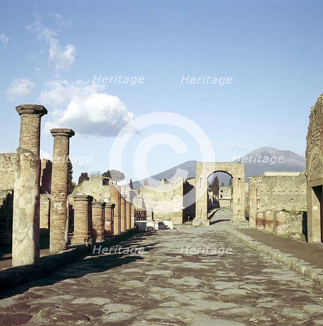 Road leading to Arch of Caligula with Vesuvius beyond, Pompeii, Italy. Creator: Unknown.