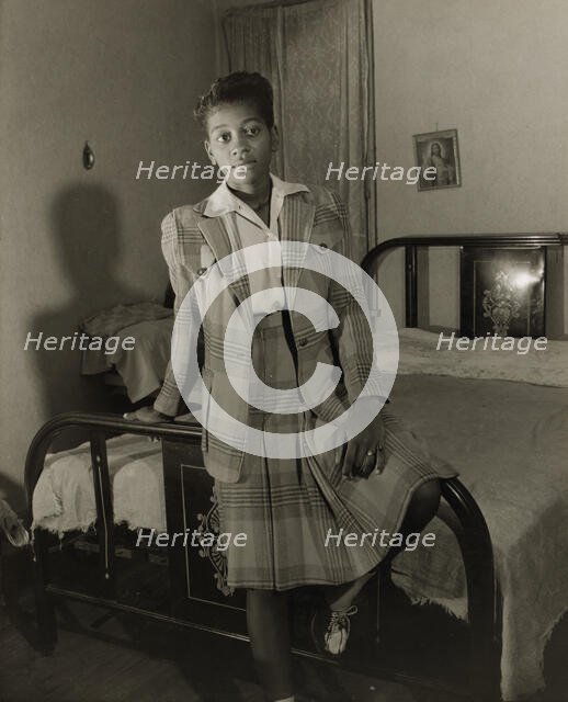 Adopted daughter of Mrs. Ella Watson, a government charwoman, Washington, D.C., 1942. Creator: Gordon Parks.