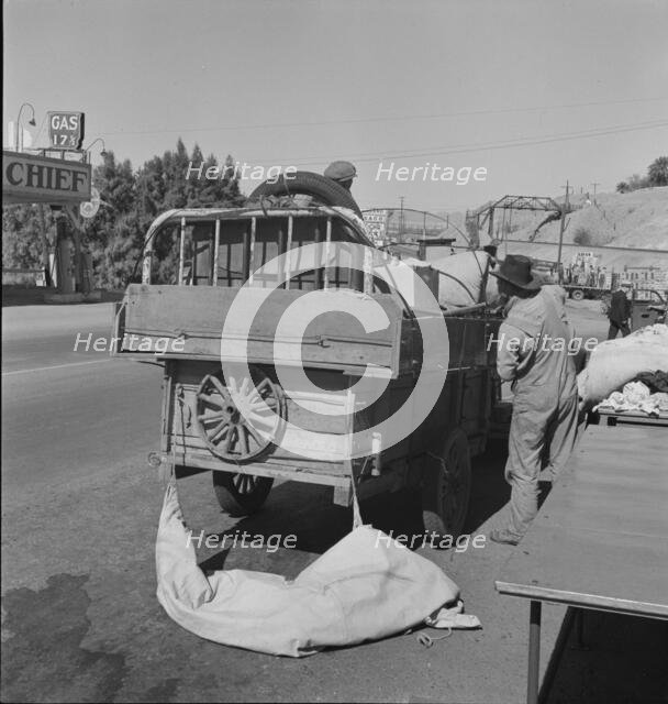 Drought refugees stopped at inspection station on the California-Arizona state line, 1937. Creator: Dorothea Lange.